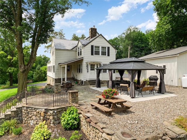 back of property with a patio area