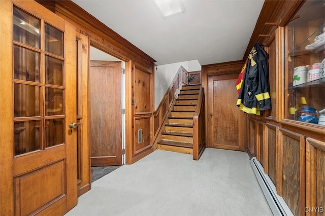 spacious closet with light carpet and baseboard heating