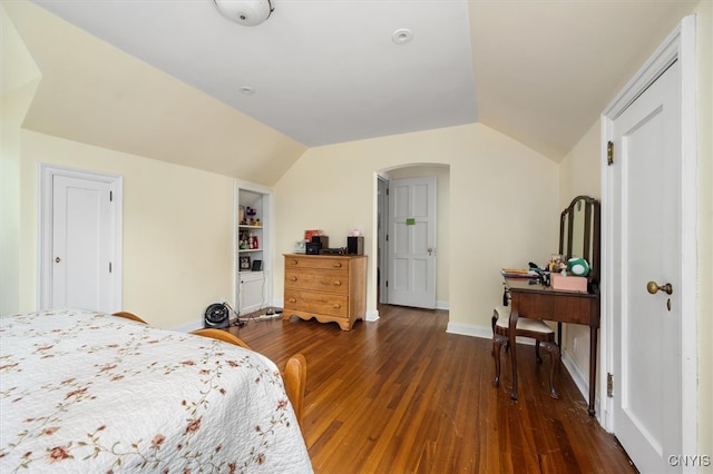 bedroom with dark hardwood / wood-style flooring and vaulted ceiling