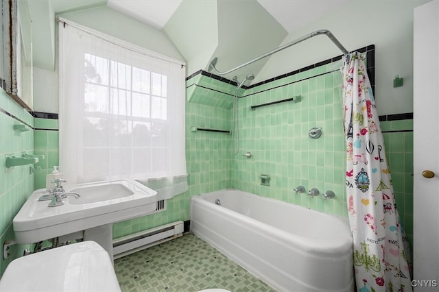 bathroom featuring tile patterned flooring, tile walls, baseboard heating, and shower / tub combo with curtain