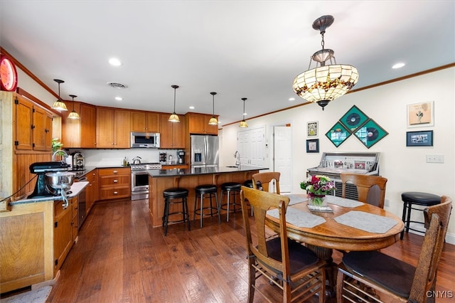 dining space with crown molding, sink, and dark hardwood / wood-style flooring