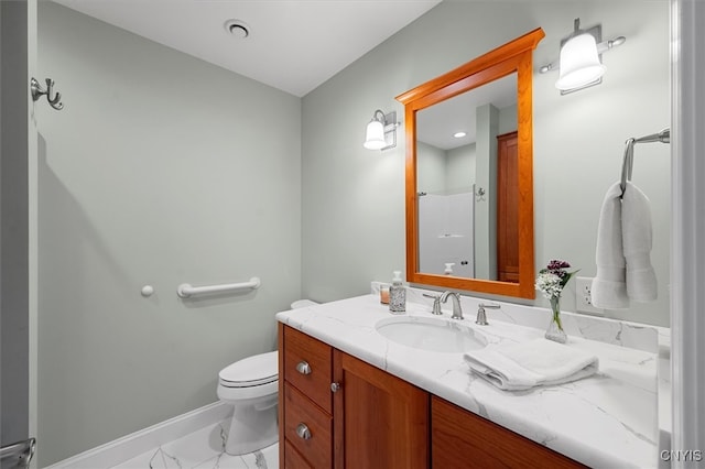 bathroom featuring vanity, tile patterned flooring, and toilet