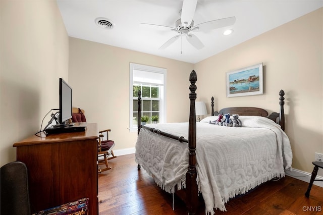 bedroom with ceiling fan and dark hardwood / wood-style floors