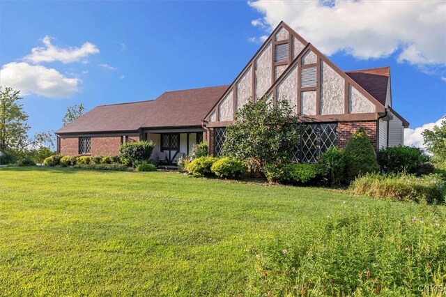 tudor house with a front yard