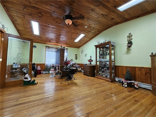 misc room featuring light hardwood / wood-style floors, wooden ceiling, ceiling fan, and lofted ceiling