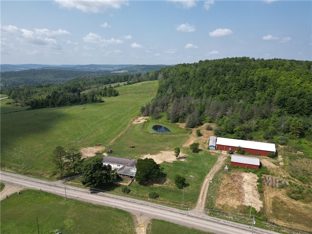 birds eye view of property with a rural view