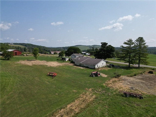 drone / aerial view with a mountain view and a rural view
