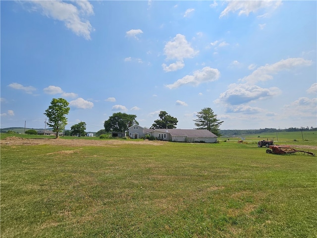 view of yard with a rural view