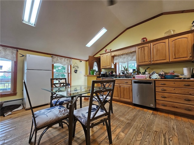 kitchen featuring white refrigerator, hardwood / wood-style flooring, a skylight, dishwasher, and a baseboard radiator