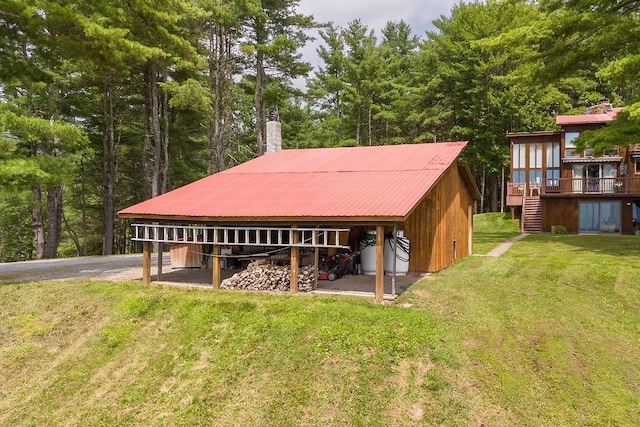 200 Onistagrawa Ln, Fulton, NY 12122 - exterior space with stairs, an outdoor structure, metal roof, and a yard