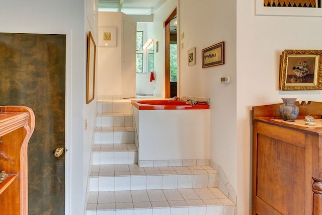 stairway with tile patterned flooring