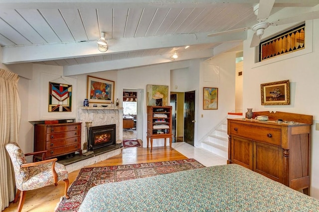 200 Onistagrawa Ln, Fulton, NY 12122 - bedroom with light wood-style flooring, a warm lit fireplace, and wood ceiling