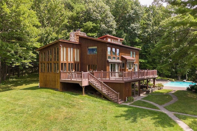 200 Onistagrawa Ln, Fulton, NY 12122 - back of property featuring a deck, a chimney, stairway, a lawn, and an outdoor pool