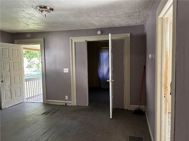 interior space with a textured ceiling