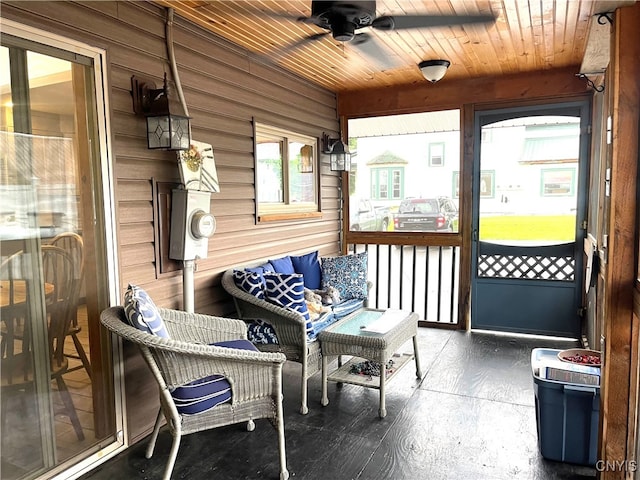 sunroom with wooden ceiling and ceiling fan