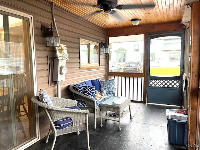 sunroom / solarium with wooden ceiling and ceiling fan