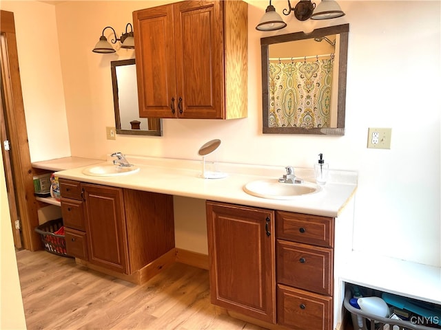 bathroom featuring double vanity and hardwood / wood-style floors