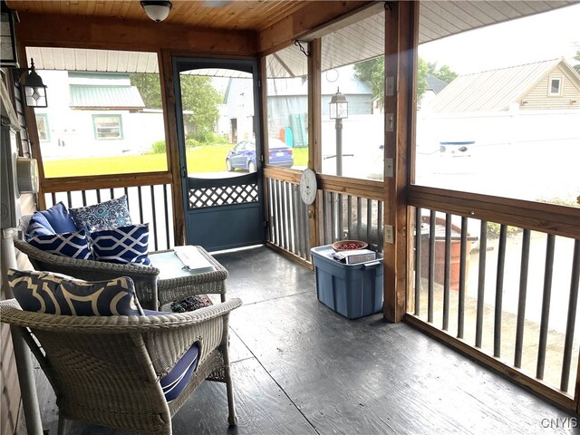 sunroom / solarium with wood ceiling