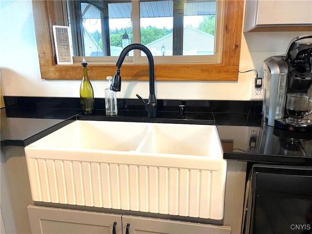 interior details featuring dark countertops and a sink