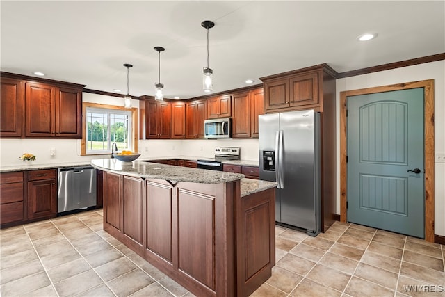 kitchen with a center island, appliances with stainless steel finishes, light stone countertops, pendant lighting, and ornamental molding