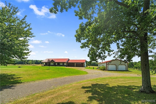 view of yard with an outbuilding and a garage