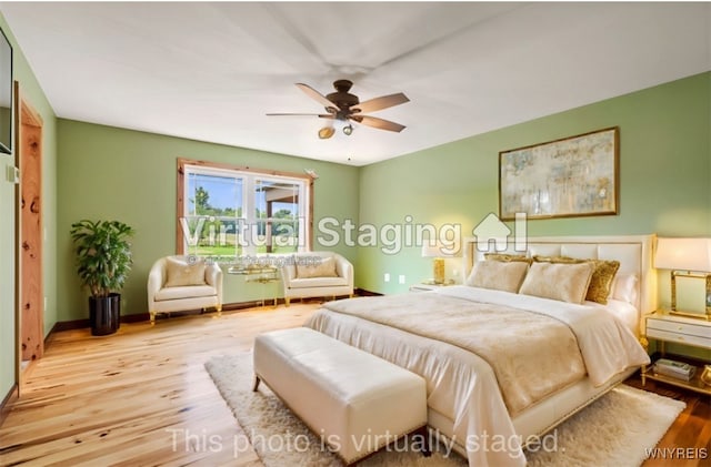 bedroom featuring light wood-type flooring and ceiling fan