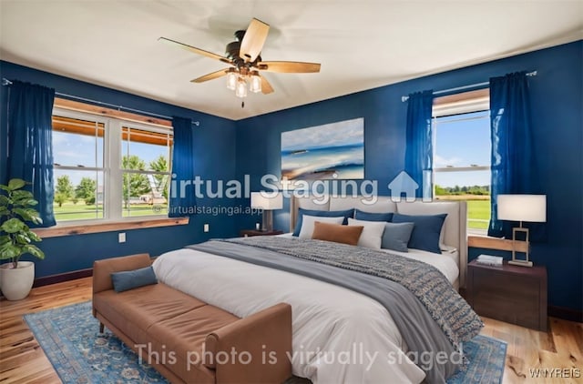 bedroom featuring ceiling fan and light hardwood / wood-style floors