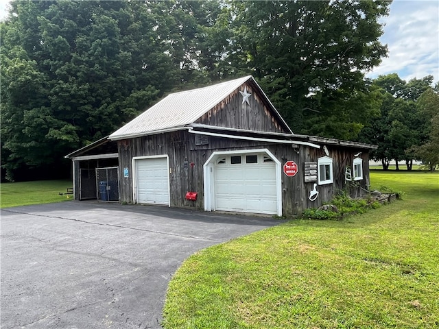 garage with a yard