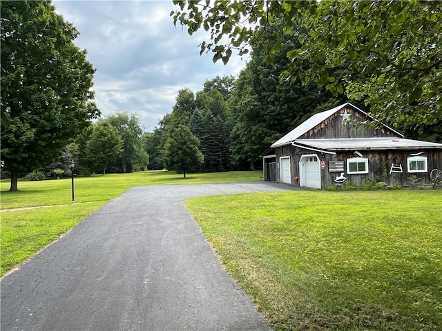 exterior space with a garage and a front lawn