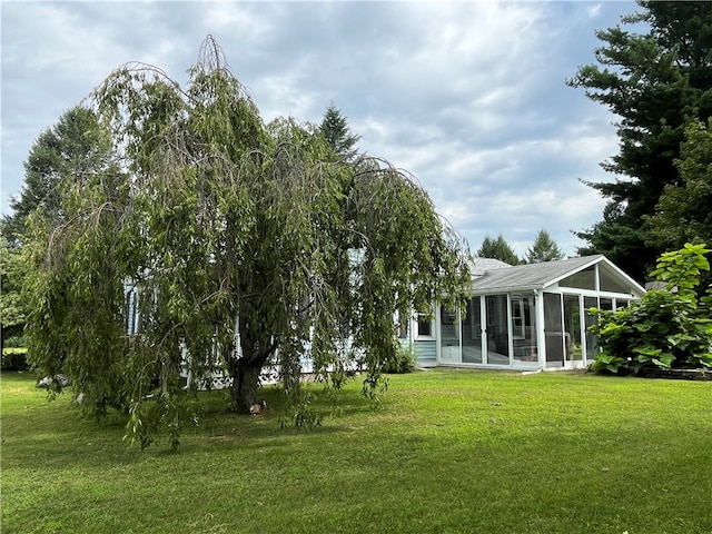 view of yard featuring a sunroom