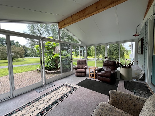 sunroom with lofted ceiling with beams