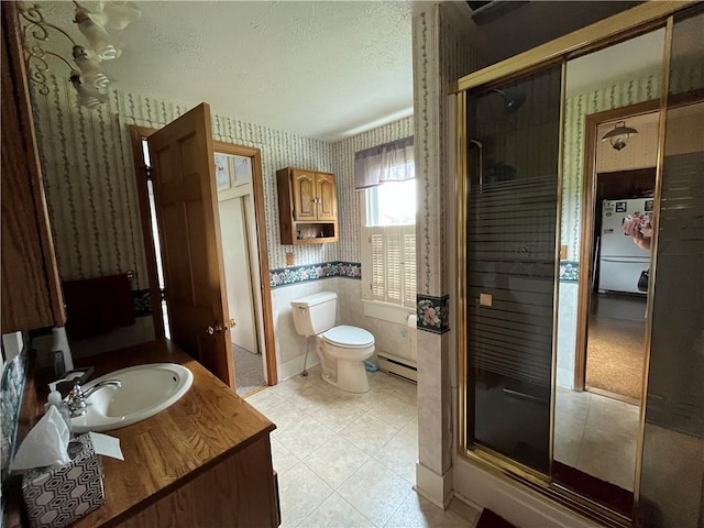 bathroom with an enclosed shower, tile patterned flooring, a textured ceiling, toilet, and a baseboard radiator