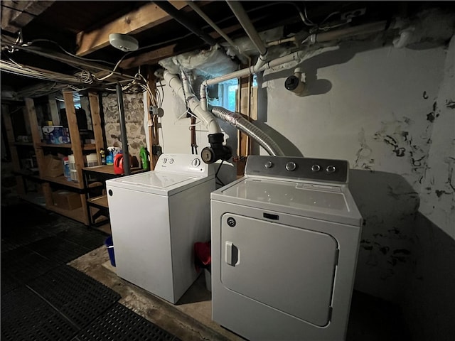 washroom featuring washing machine and dryer