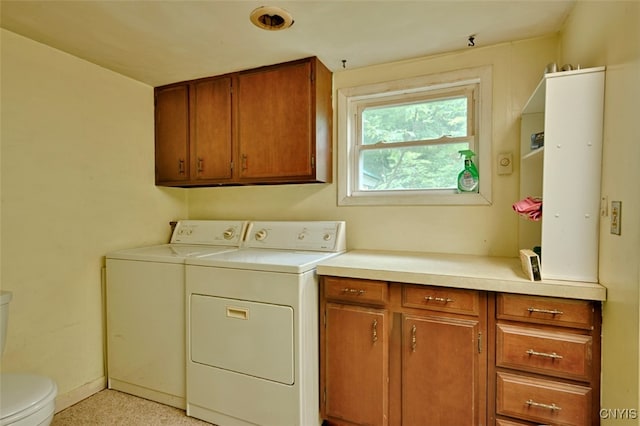 clothes washing area with washer and dryer