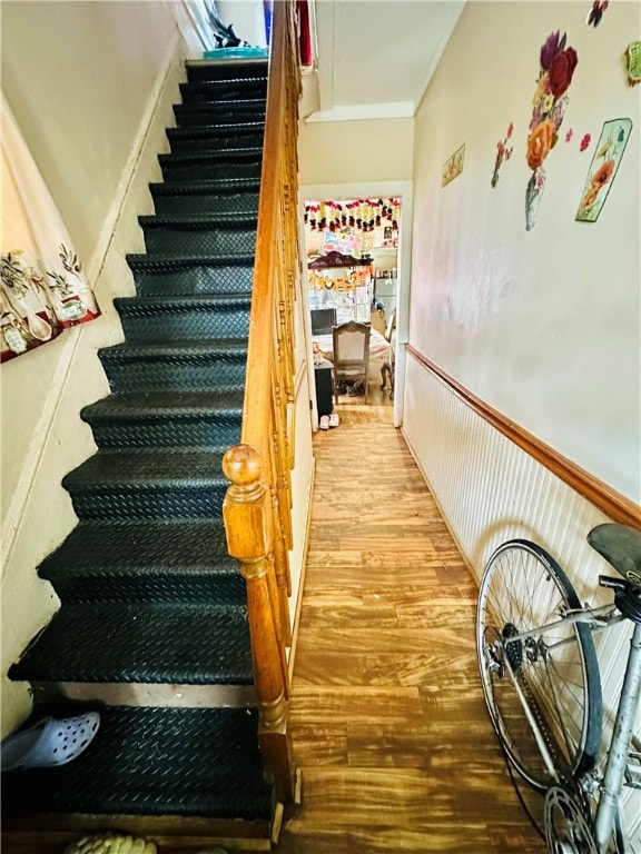 stairs with light wood-type flooring