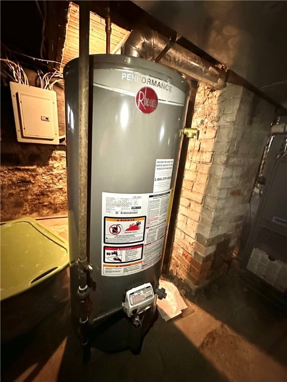 utilities with water heater and electric panel