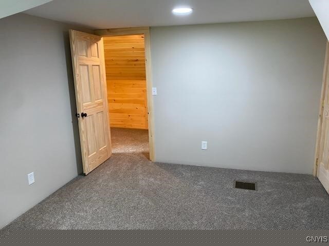 empty room featuring carpet floors