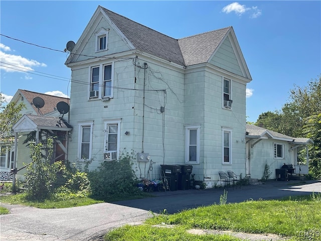 view of front of property featuring cooling unit