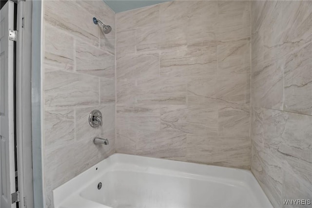 bathroom with shower / tub combination