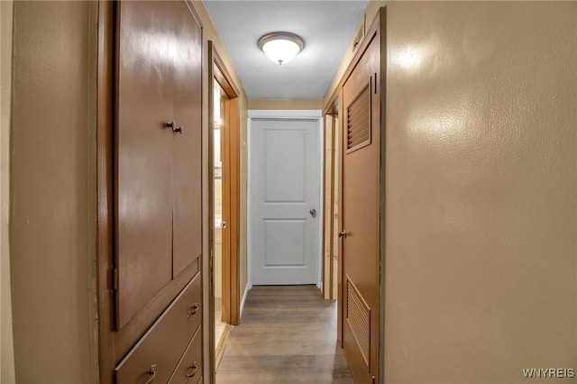 hallway featuring light wood finished floors