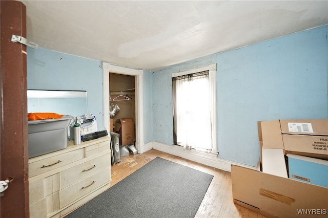 bedroom featuring a closet and light hardwood / wood-style floors