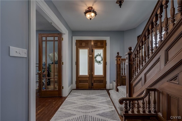 entryway featuring french doors and dark hardwood / wood-style floors