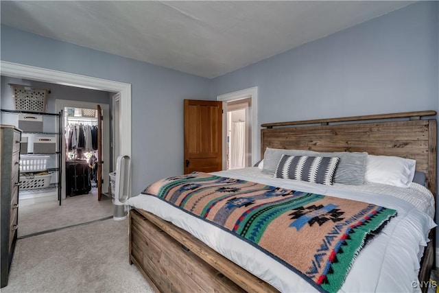 carpeted bedroom featuring a closet