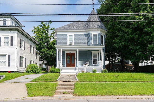 victorian-style house with covered porch and a front lawn