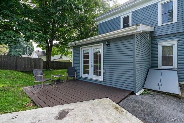 wooden terrace with a yard