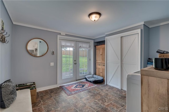 foyer entrance with french doors and crown molding