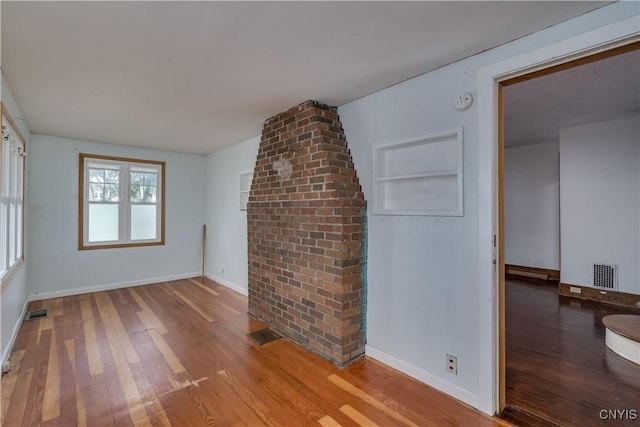 unfurnished living room featuring light wood-type flooring