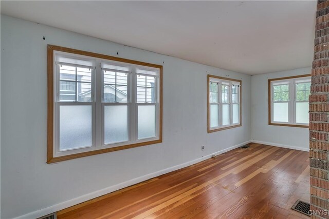 spare room featuring hardwood / wood-style flooring