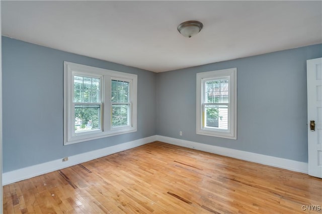 unfurnished room featuring light wood-type flooring