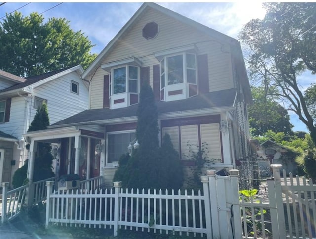 view of front of house featuring a sunroom